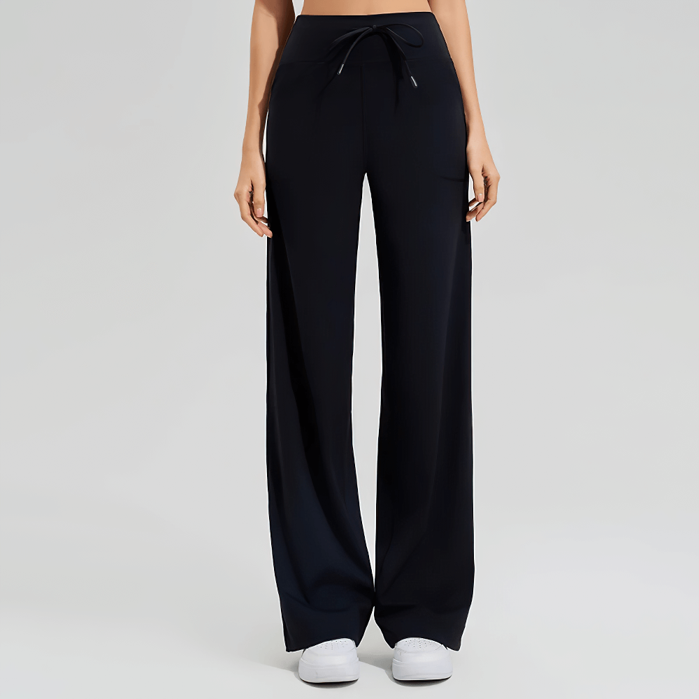 Women's high-waist flared yoga pants with pockets, perfect for workouts and casual wear. Stylish Lycra blend for comfort and mobility.